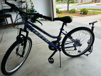 Huffy 24” Rock Creek Mountain Bike, fits riders 58-70”, purple, Adult, women’s , with black burn air tower 3 pump … rarely used..