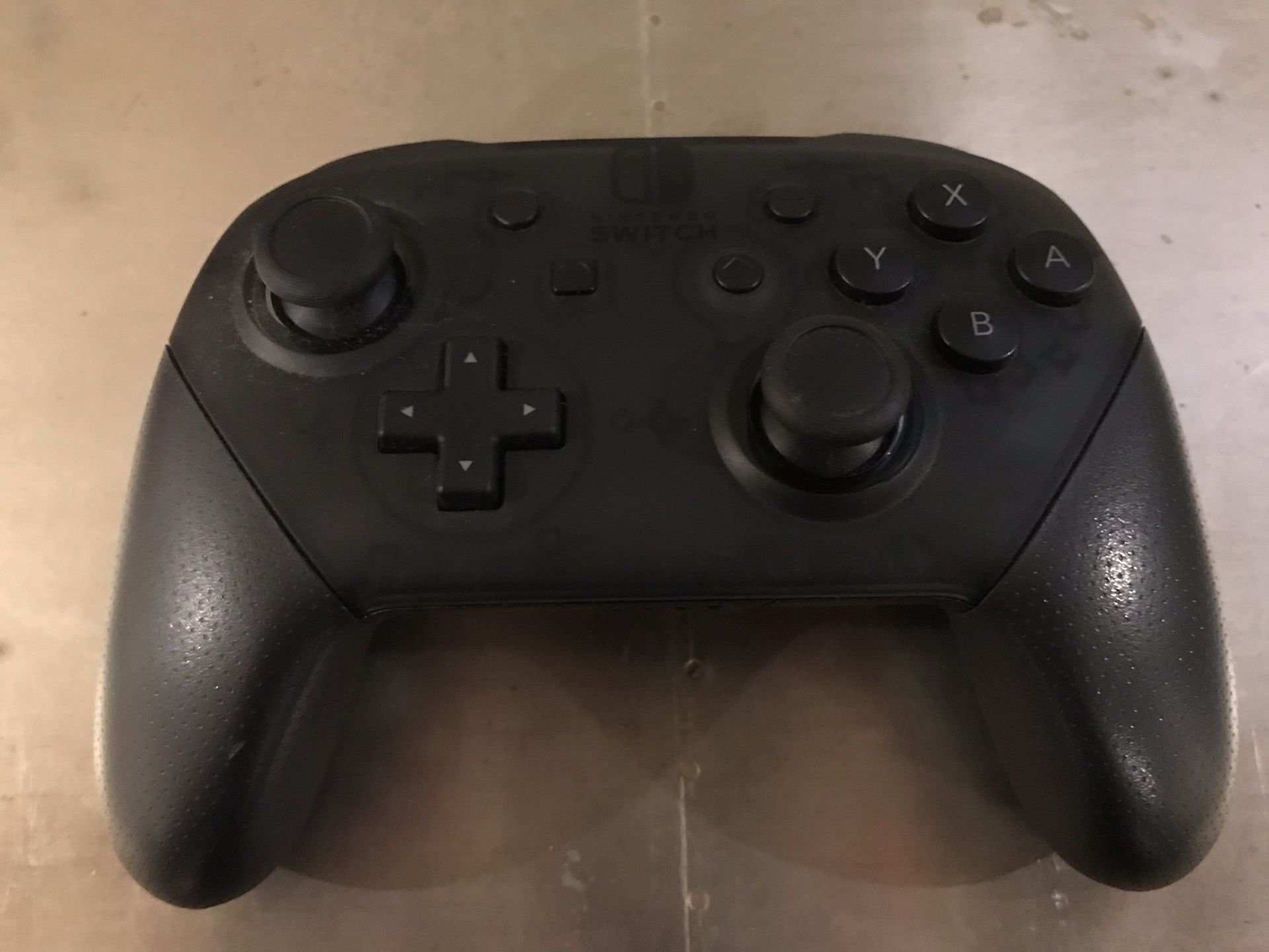 Nintendo Switch Pro Controller with cable and packaging