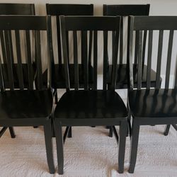 6 wooden dining chairs.  Used.   Normal wear, but so durable and lots of life left in them.