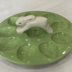 Green ceramic deviled egg plate with a white rabbit figurine. 8.5”
