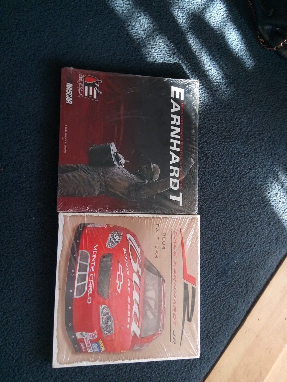 Two packs of collectible Earnhardt and Jr. Calendars