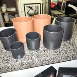 Bundle Of 7 Smaller Flower Pots With Bases.