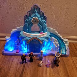 Disney Frozen Castle (has music and lights) and Figurines.... $45