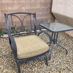 1 chair outside doors with coffee table (racking)