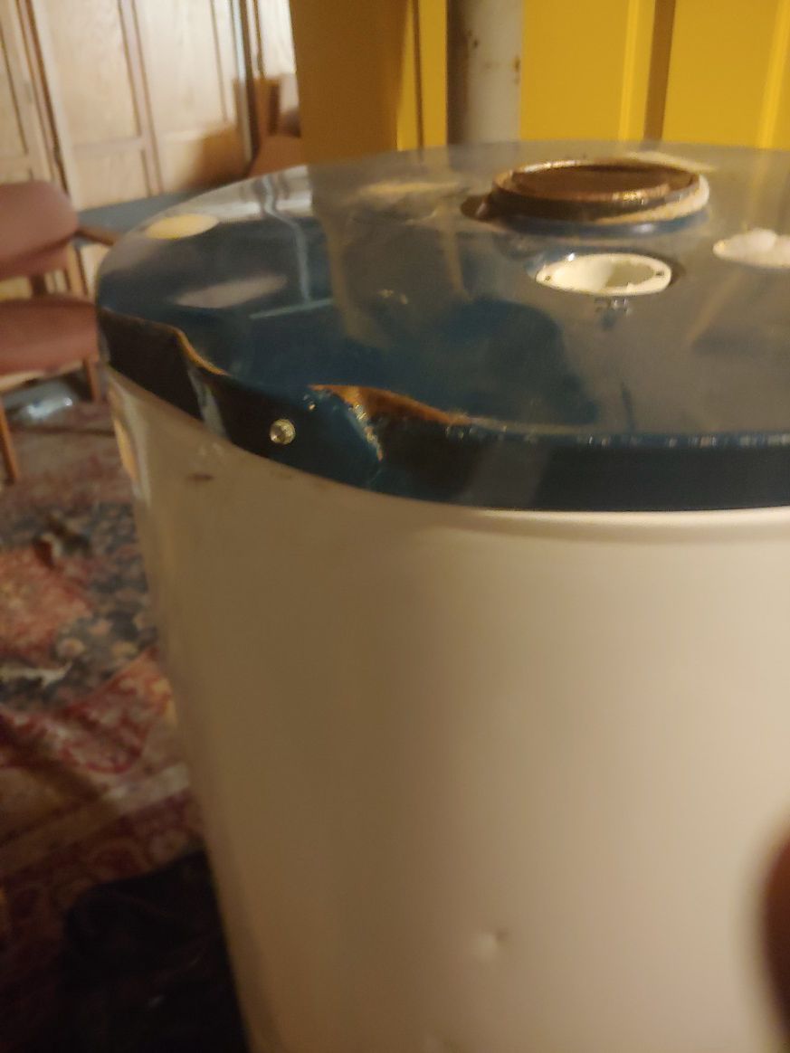 Propane water heater...dented but new...works great