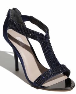 GLINT 'Devyn' Sandal Allover rhinestone studs add a bit of tough-girl glamour to a shimmering sandal on a daring stiletto heel. - Approx. heel height