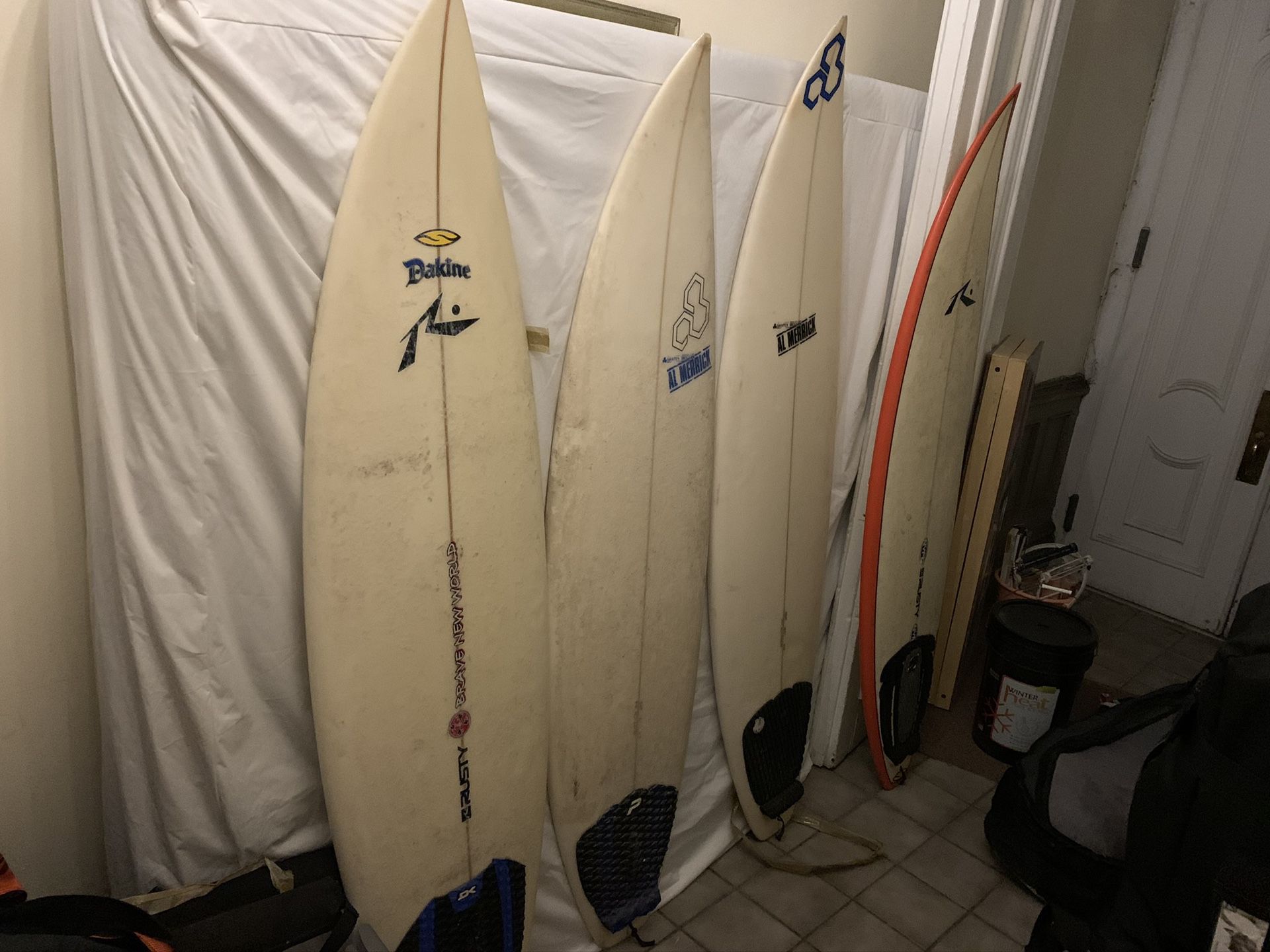 Four Beautiful Surfboards and bag and rack.