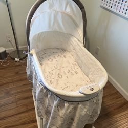 Delta children bassinet with music and light