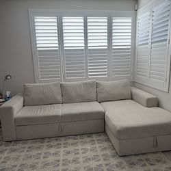 Living Space Sebastian Cream White Beige Fabric 111" 2 Piece Convertible Futon Sleeper Sectional with Left Arm Facing Storage Chaise