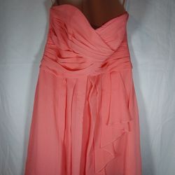 David's Bridal coral strapless dress, specifically identified as a short crinkle chiffon dress with a front cascade