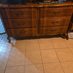 Six drawer dresser good shape over all.  It does have some stuffs and faded off of original paint but nothing that a touch up can fix. Price is reason