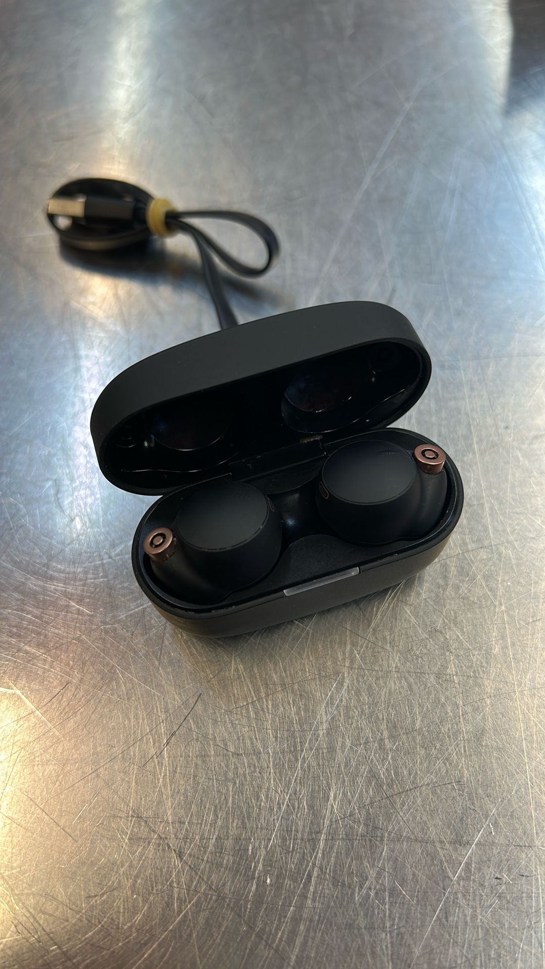 Sony Bluetooth in ear earbuds with Charging Case in cord