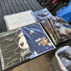 1 lot of unopened material. banners. table cloth. bags. photo booth backdrop 