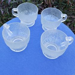 4 GLASS BOWLS WITH HANDLES AND A FROSTED LOOK