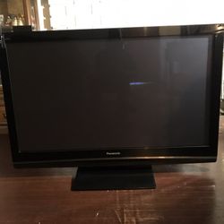 Panasonic 50 inch HD TV with remote control and Firestick