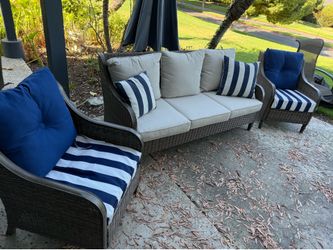 Three piece patio furniture set - one couch and two armchairs