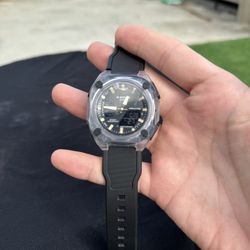 This is a Casio G-Shock analog-digital watch with a clear resin case and black resin stra