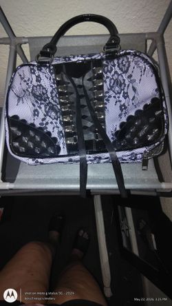 Lace makeup bag with spikes and ribbon