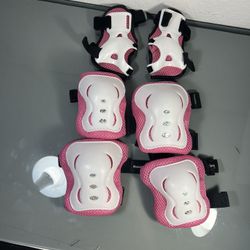 Girl pink and white protective gear 