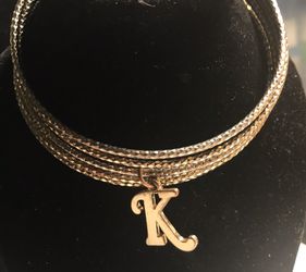 $25 Gold color bangle bracelets w/K charm