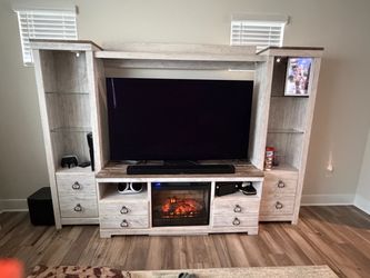 Entertainment console with electric fireplace