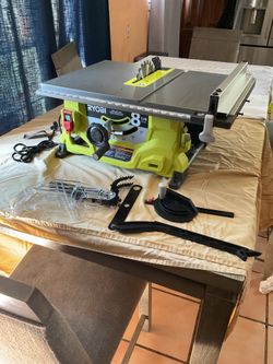 Ryobi 8 1/4 inch table saw with all the accessories corded pick up here in La Puente