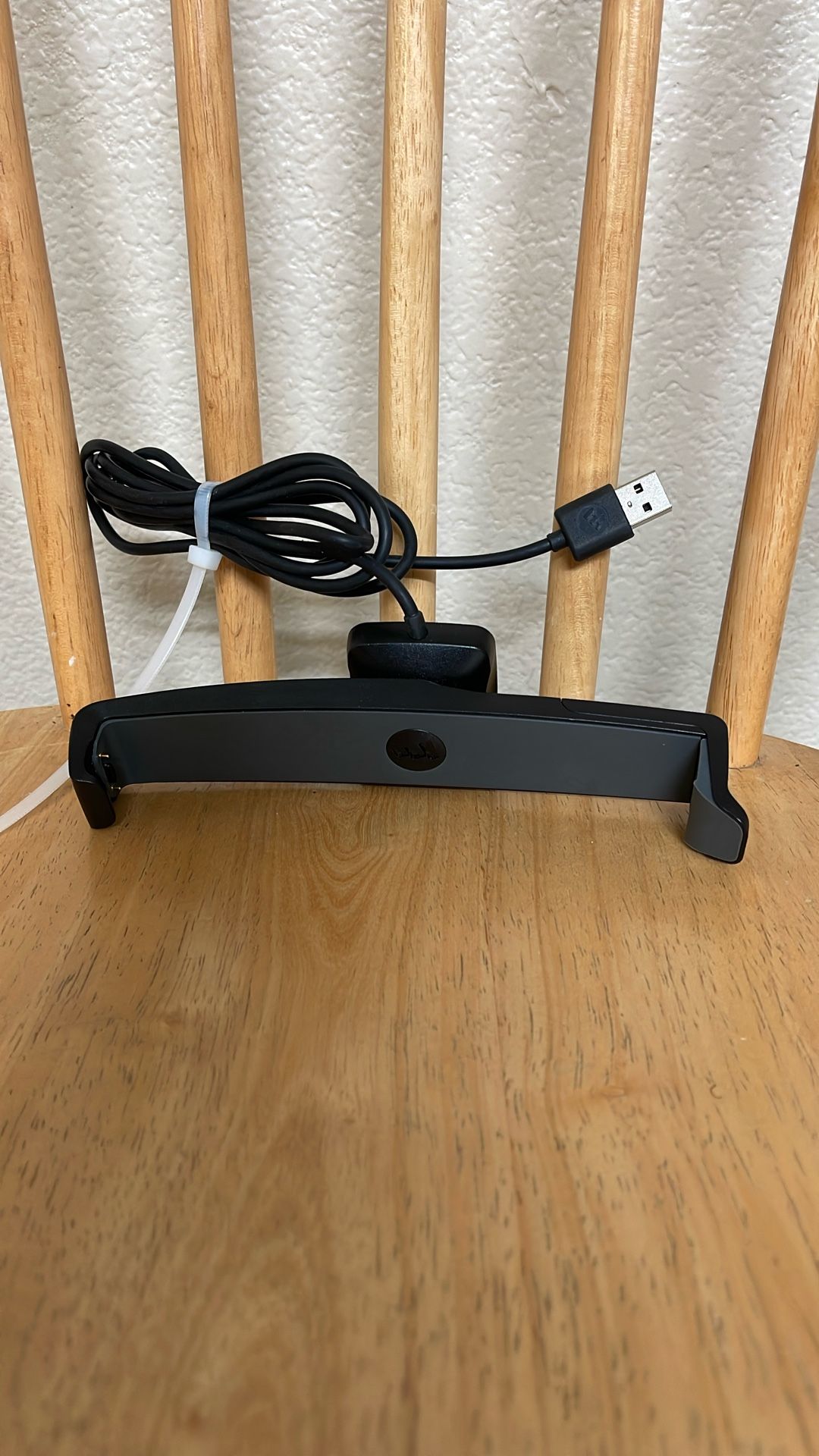 charging dock or stand for an electronic device, possibly a wearable use