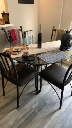 Table ( Glass) with four chairs !