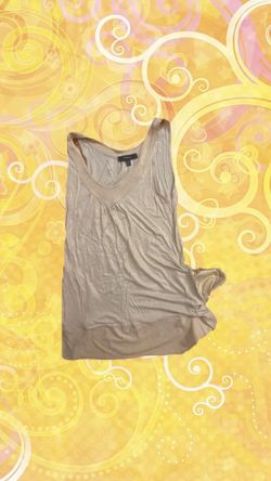 Yellow cream tank top with snake print details, has pockets with the snake print