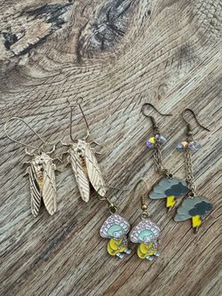 Costume jewelry earrings cicadas stormy mushroom forage person