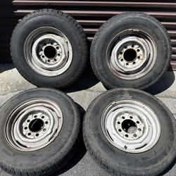16.5 inch stock steelies with old tires 8 lug GMC or Chevy rollers 