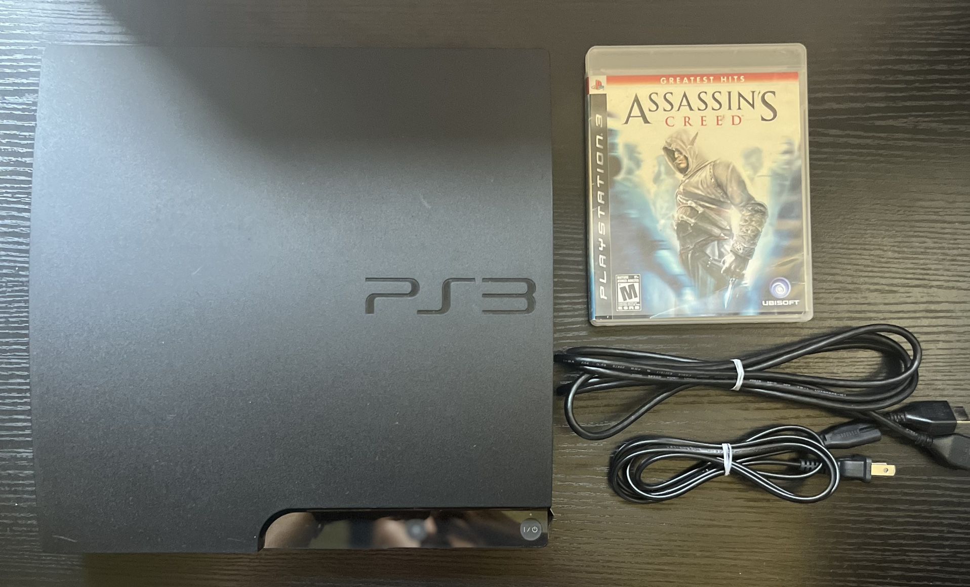 PS3 SLIM + ASSASSIN’S CREED 
