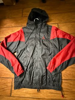 This black and red Nike Air Jordan windbreaker features a prominent embroidered Jumpman logo on the chest  Small on tag  Very good condition  Smoke fr