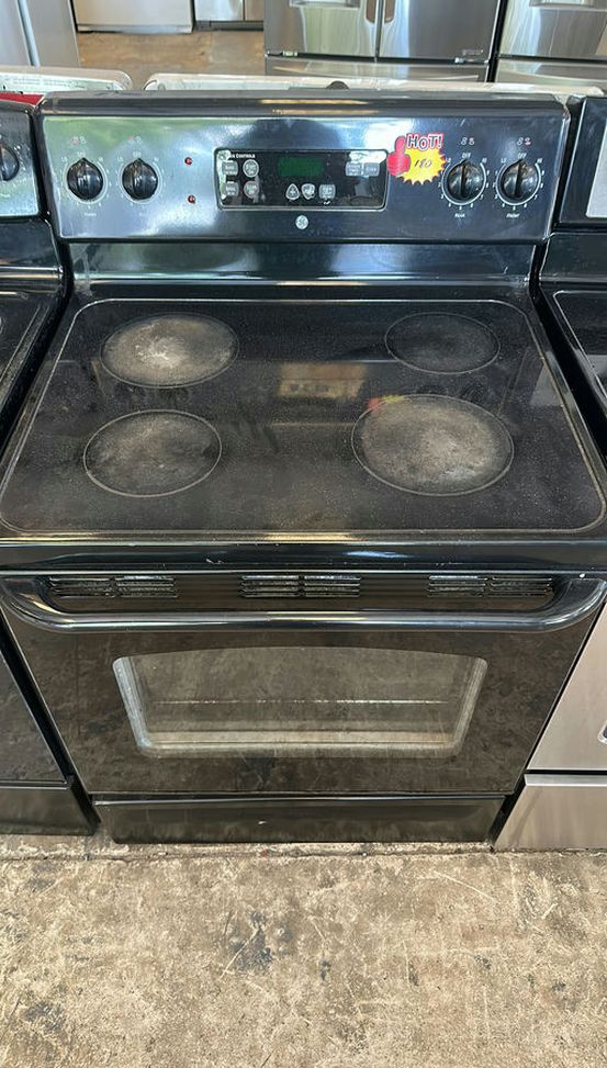 Black GE Electric Range with Glass Top