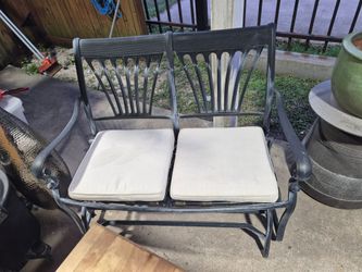 Nice Used cast iron aluminum two Seater glider. With Two bottom cushions.