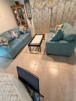 One sofa and one loveseat excellent condition like New  with 4 sofa pillows