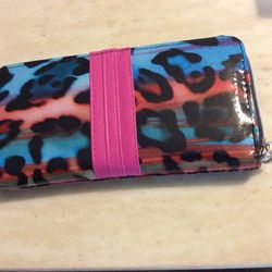 Wallet, USED, NOT LEATHER, 7 1/2 inches long by 4 inches wide, zip across top, meet at Exxon at 2428 E Lamar Alexander parkway Maryville