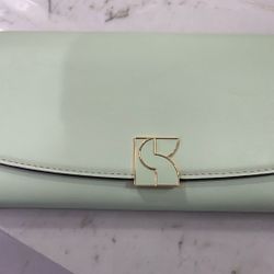 Kate Spade A beautiful ombré sunset set against a Saffiano leather backdrop makes this zip-around wallet one you'll want to show off. Top zip-aro
