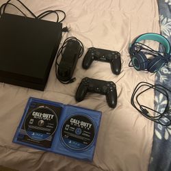 PS4 With Games, Controllers, Charging Station, And Headphones