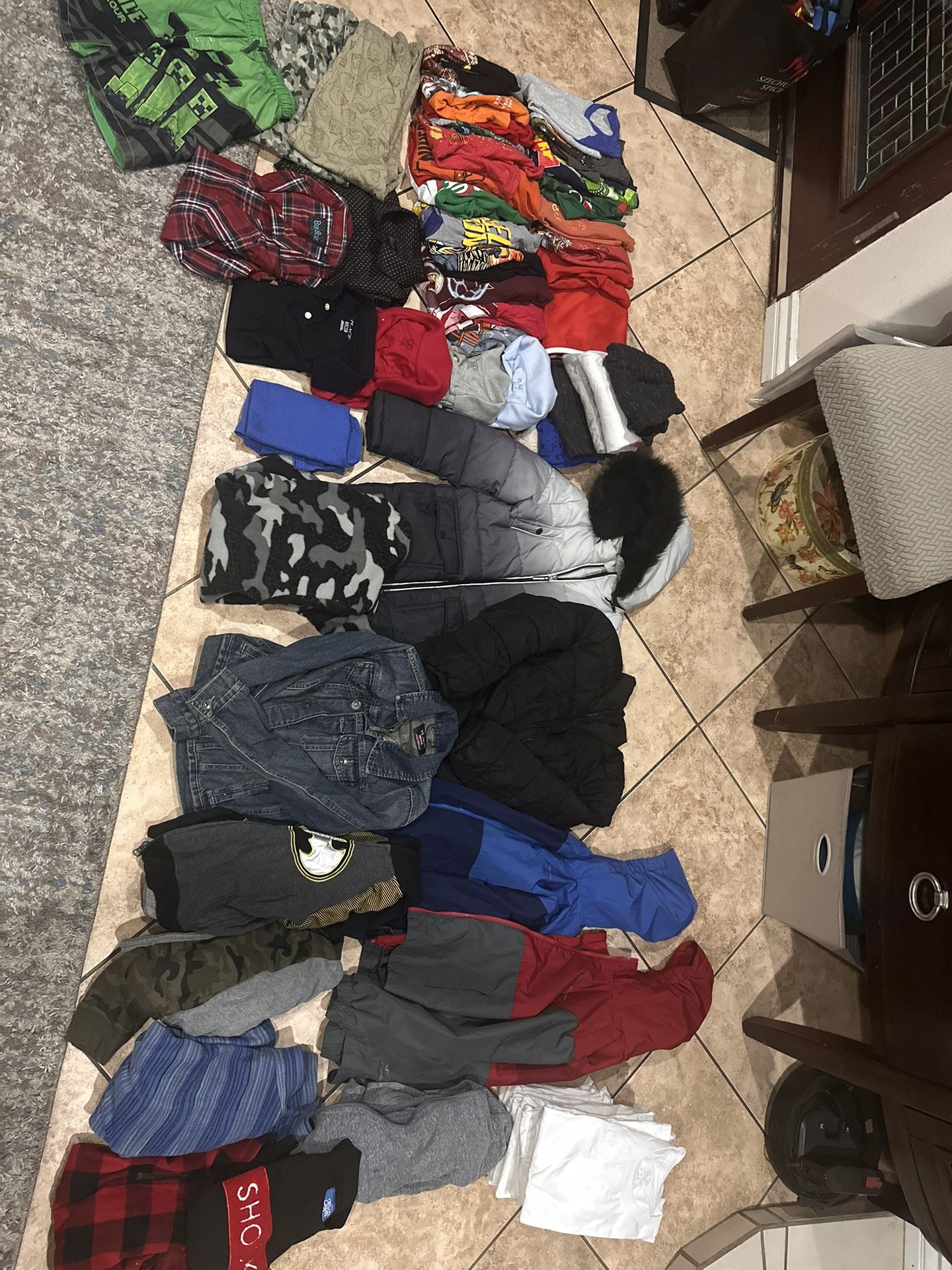 Gently used Boys clothes: t-shirts, long sleeve shirts, collar, shirts, jackets, swim shorts, shorts, sweatpants, 50 items plus stack of white T-shirt