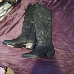 

This is a pair of black, Women's MIA Kolt western knee-high boots made from vegan leather. 