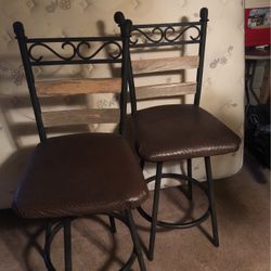 Two Swivel Bar Stools  25 Inches High