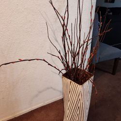 Tall vase with fake plants 