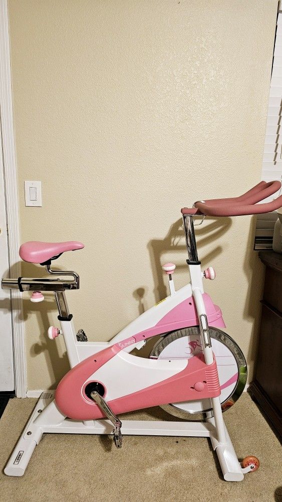 Sunny Health & Fitness Pink Indoor Cycling Exercise Stationary Bike
