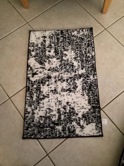 This Addison Rugs Mayfield Premium rug features a distressed black and white abstract design.