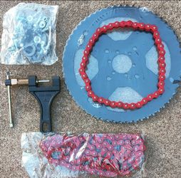 Brand new rear sprocket and sprocket that goes on the motor cuz it's two different size chains chain breaker and a set of Master links 25 $brand new