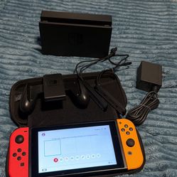 Nintendo switch with case, charger, docking station, joycon grip and case 