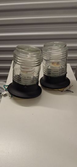2  lantern style light fixtures with bulbs