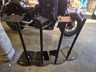Set of 4 black speaker stands with glass base