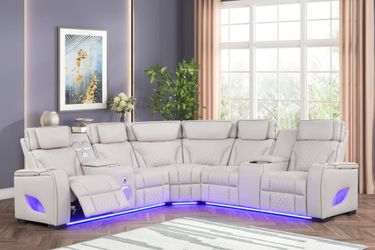 Power reclining sectional w/power headrest and wireless surround sound